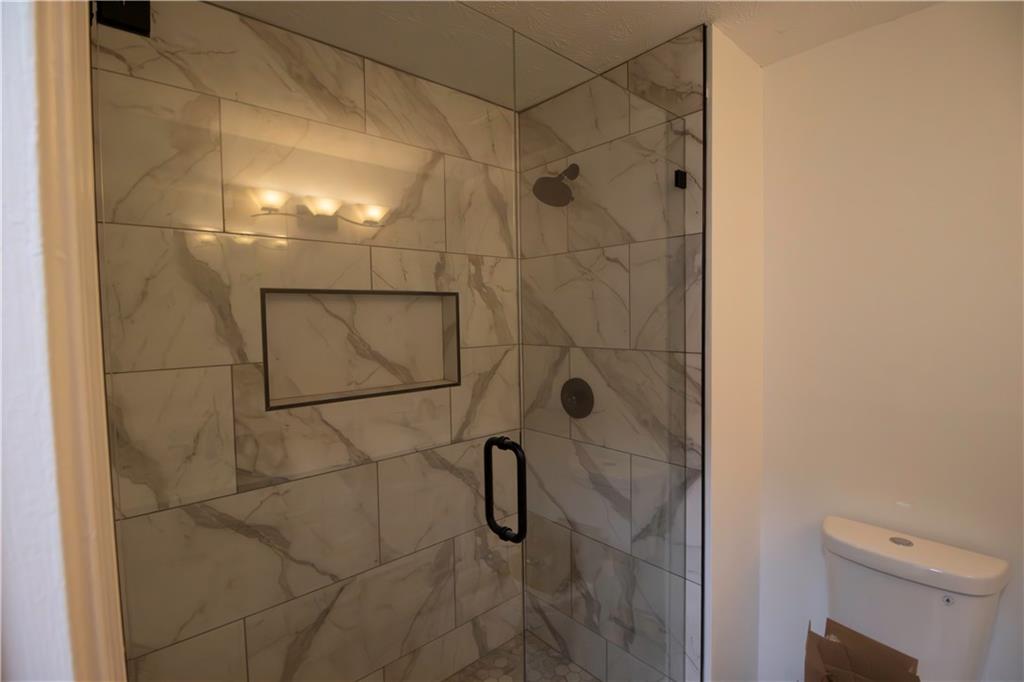 1292 Monfort Road Lawrenceville, GA 30046 - Photo 10 of 48 a bathroom with a shower