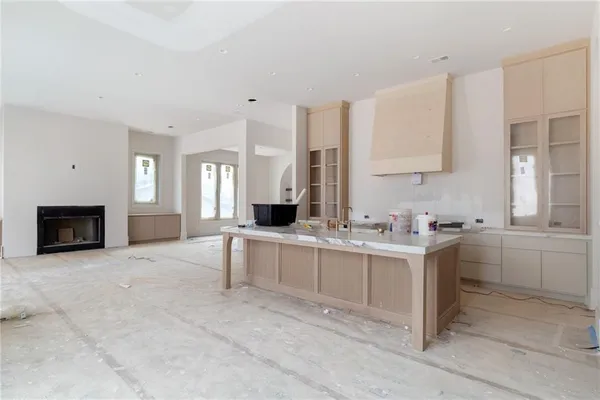 a bathroom with a tub sink and mirror