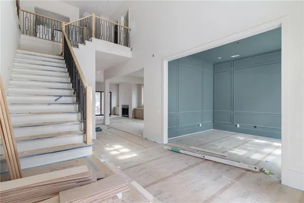 a view of entryway and hall with wooden floor