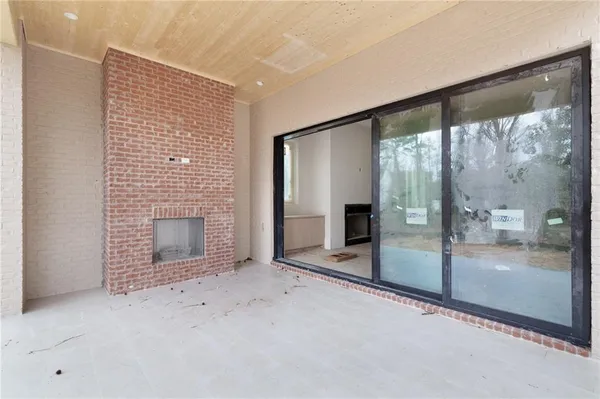a view of an empty room with a fireplace