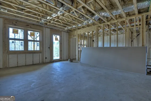 a view of an empty room with windows