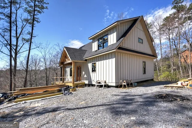 a front view of house with a garden