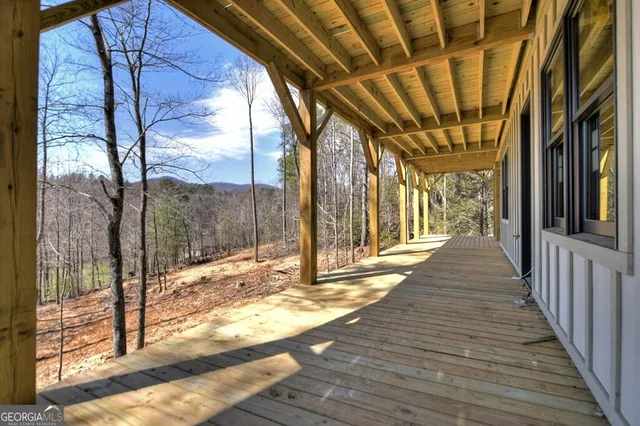 a view of porch with wooden floor