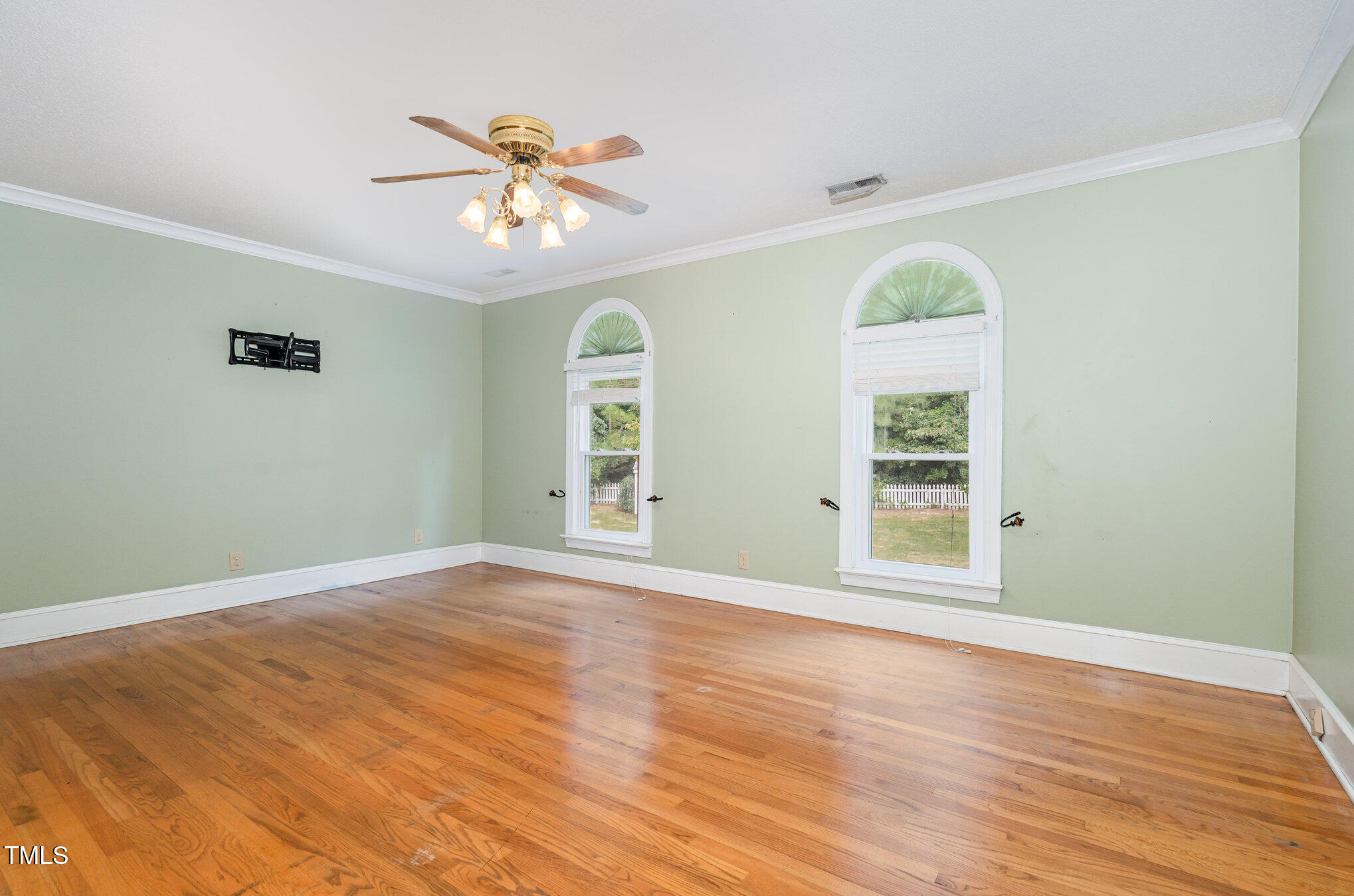 2601 Forestville Road Wake Forest, NC 27587 - Photo 15 of 25 a view of an empty room with wooden floor and a window