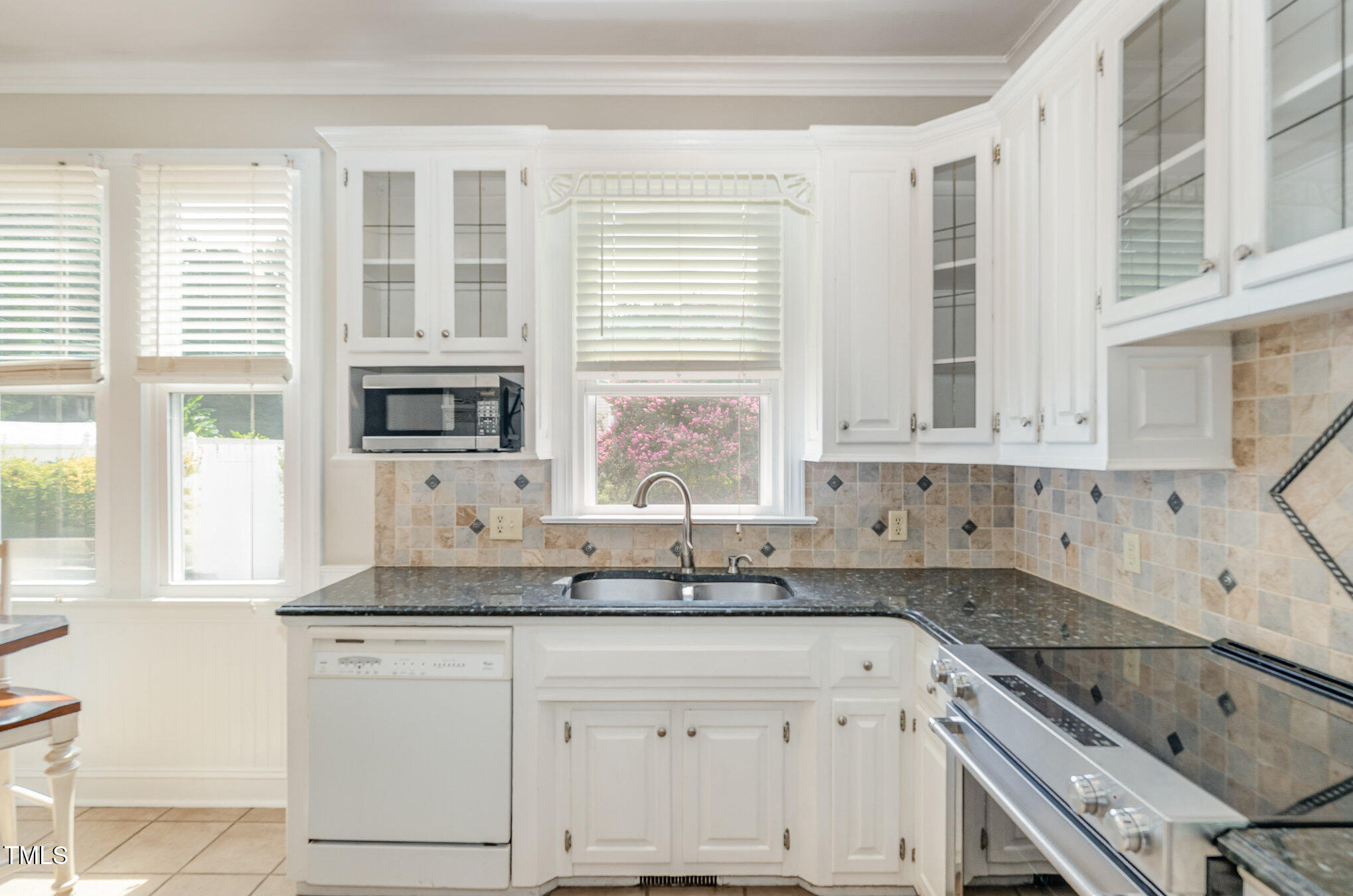 2601 Forestville Road Wake Forest, NC 27587 - Photo 6 of 25 a kitchen with granite countertop a sink and a stove