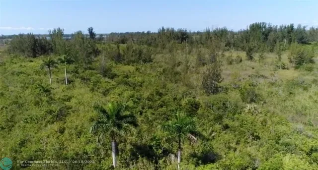 a view of a lake with a house in background