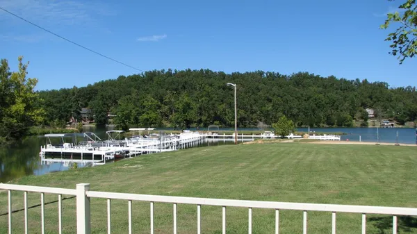 a view of a swimming pool with a big yard