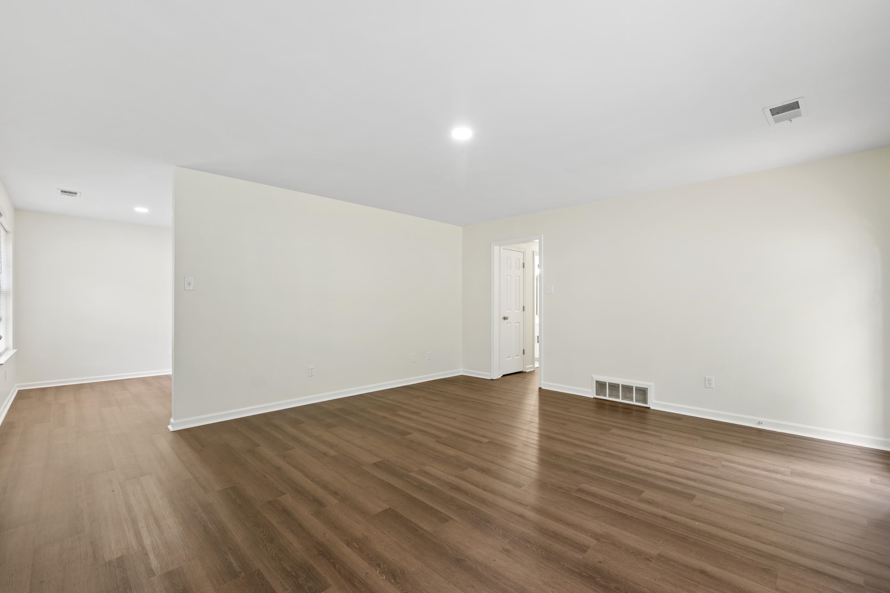 6400 Saginaw Road Memphis, TN 38134 - Photo 9 of 27 Another view of the large great room highlighting the seamless flow, neutral décor, and move-in-ready condition throughout.