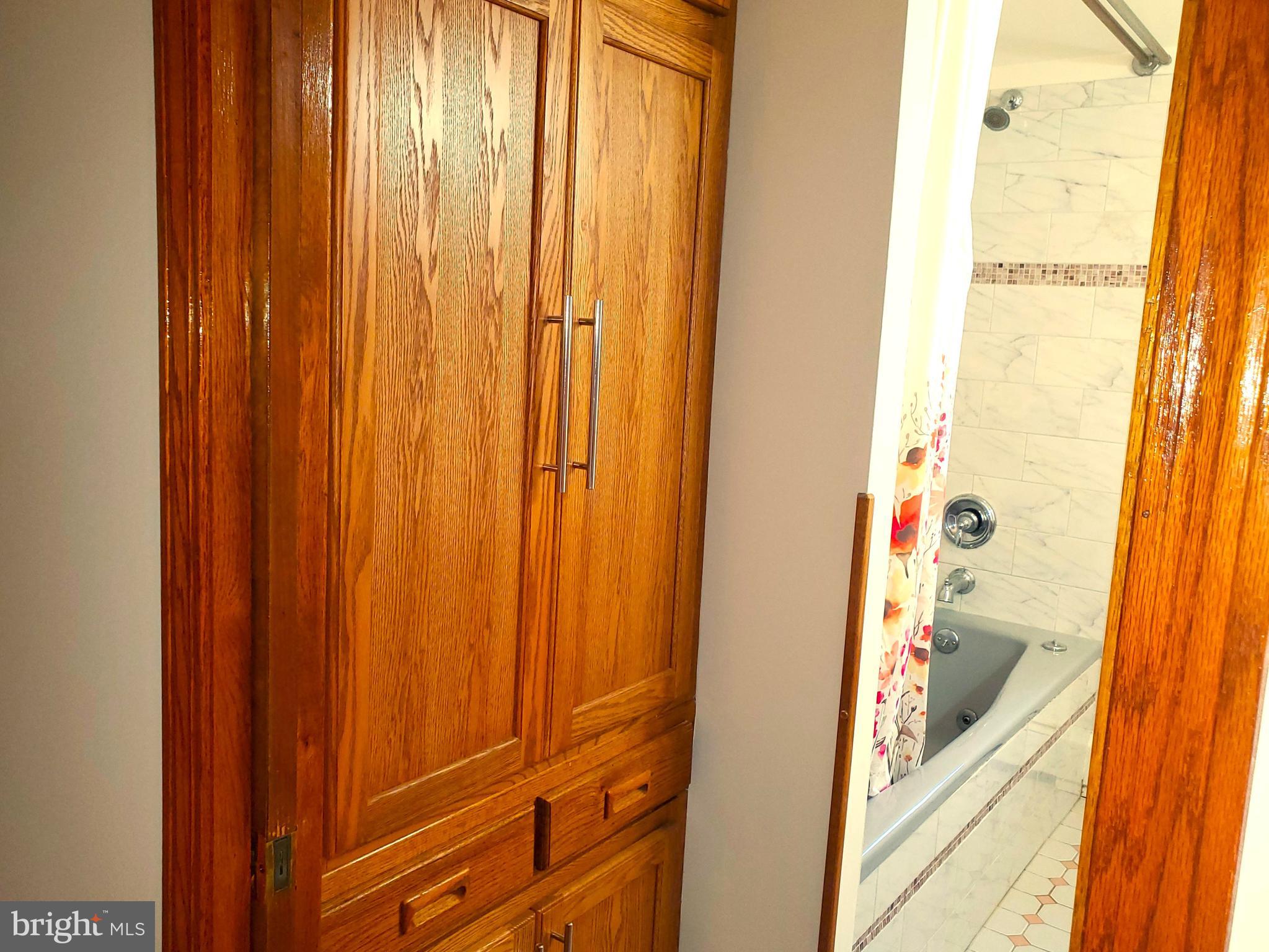 309 Elk Forest Road Elkton, MD 21921 - Photo 29 of 40 Built in oak storage cabinets in upper bathroom