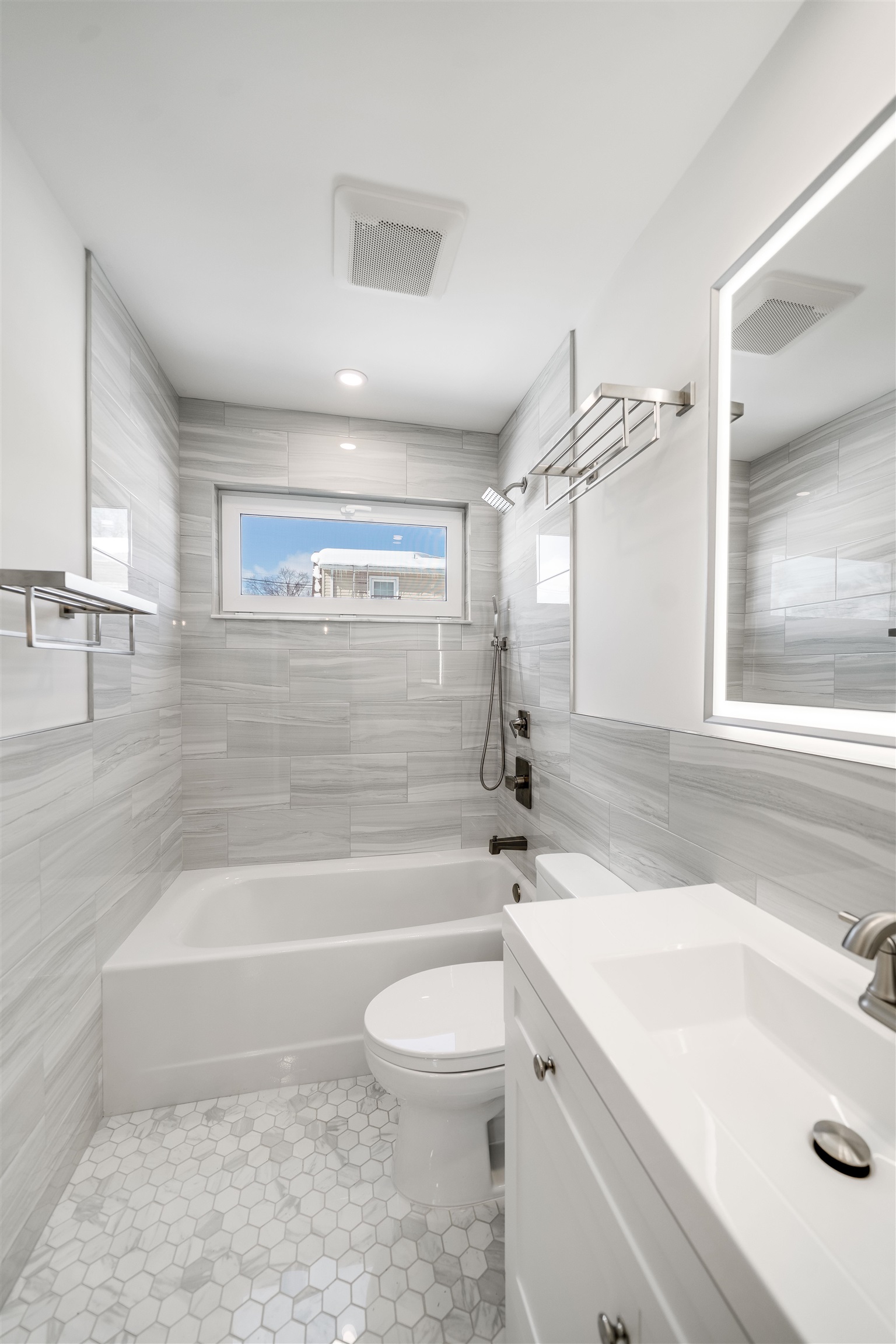 11 Walnut Street, Unit 1 Little Falls, NJ 07424 - Photo 18 of 24 a bathroom with a sink a toilet and a bathtub