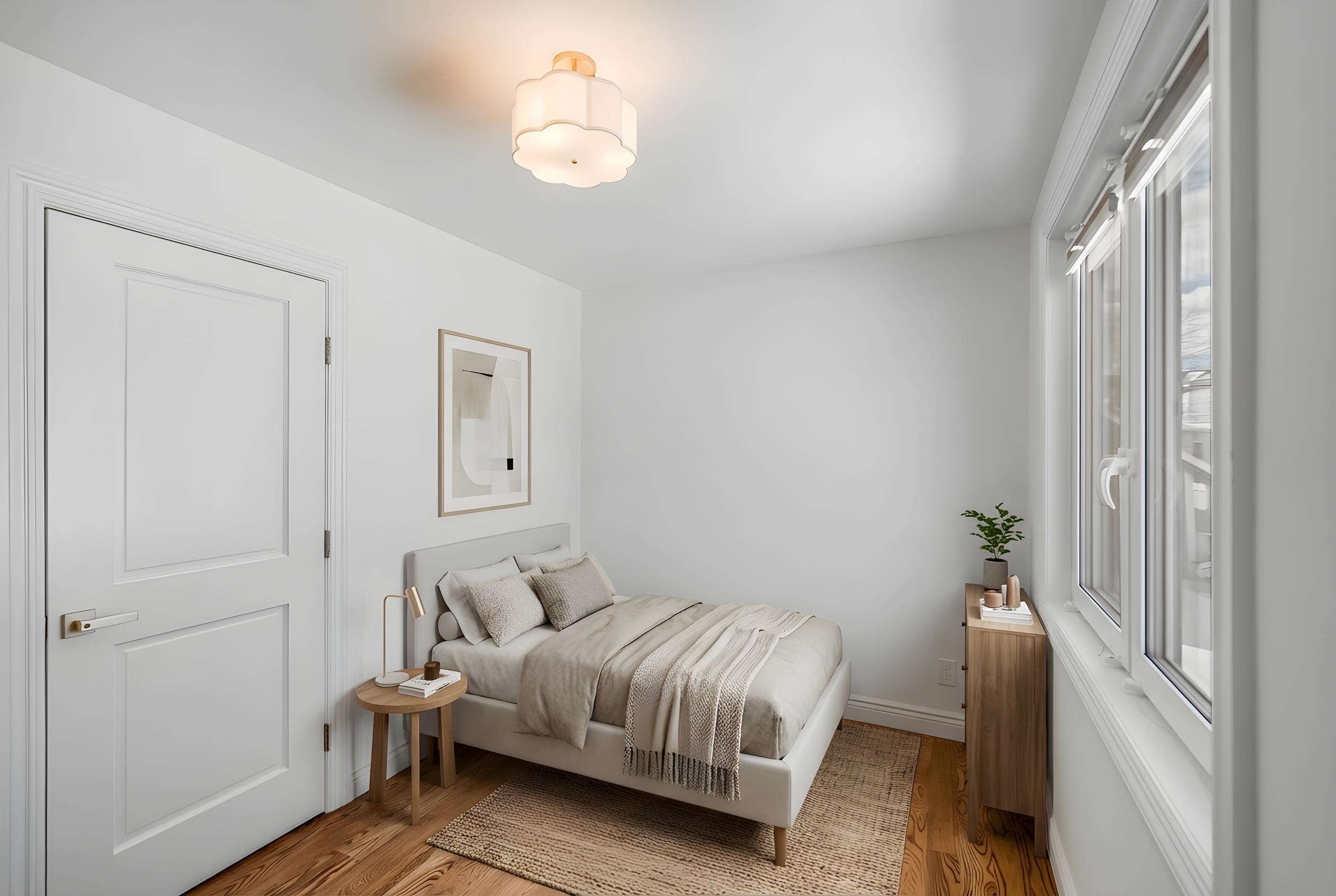 11 Walnut Street, Unit 1 Little Falls, NJ 07424 - Photo 22 of 24 a bedroom with a bed and a chandelier