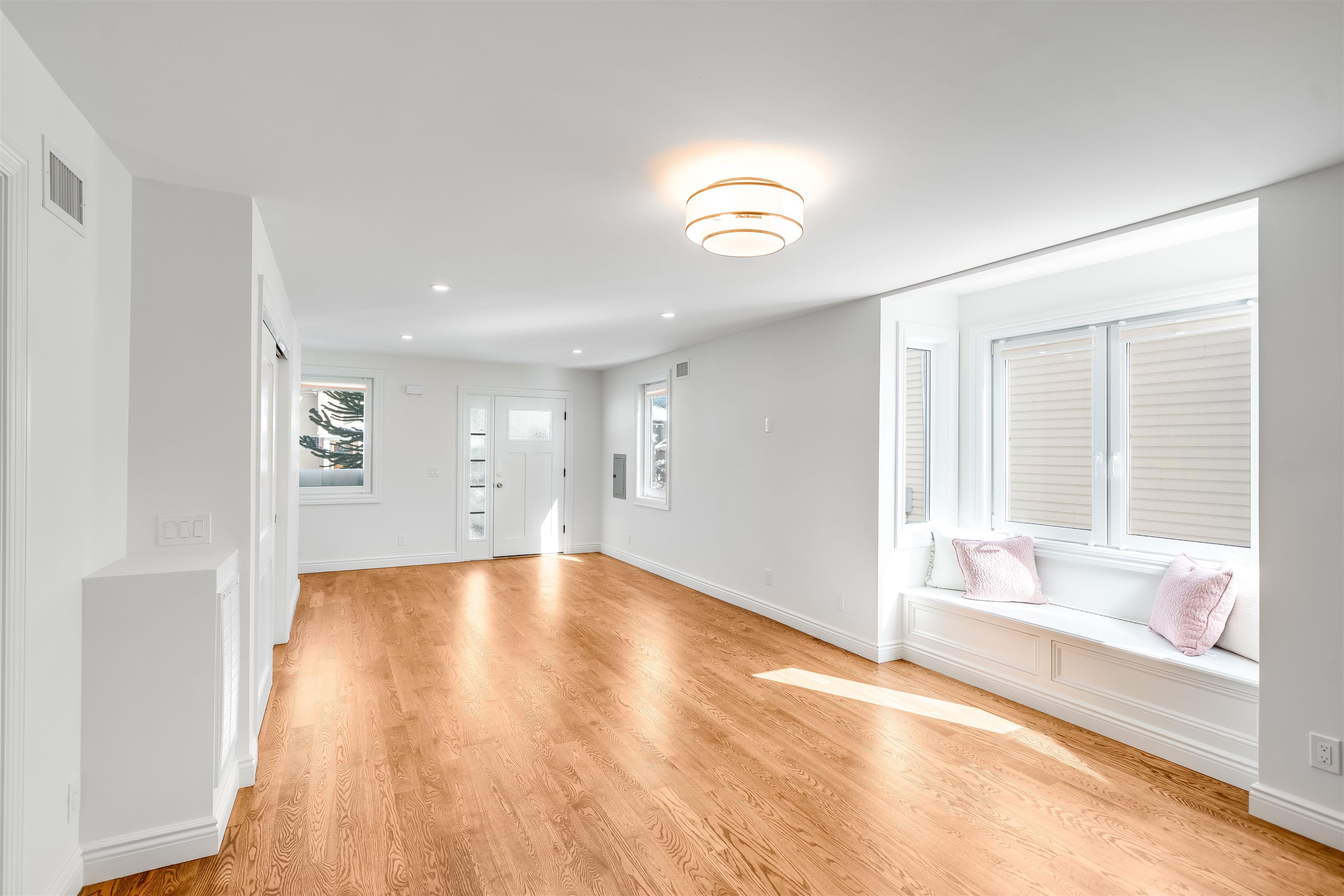11 Walnut Street, Unit 1 Little Falls, NJ 07424 - Photo 9 of 24 an empty room with wooden floor and windows