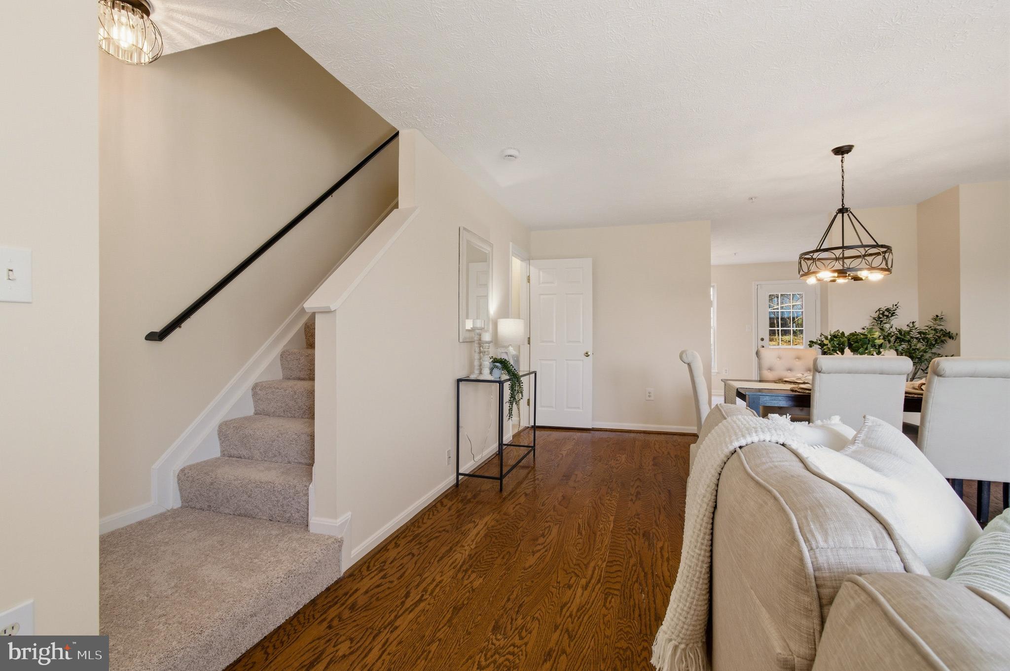 9054 Constant Course Columbia, MD 21046 - Photo 14 of 61 a view of a livingroom with furniture and staircase