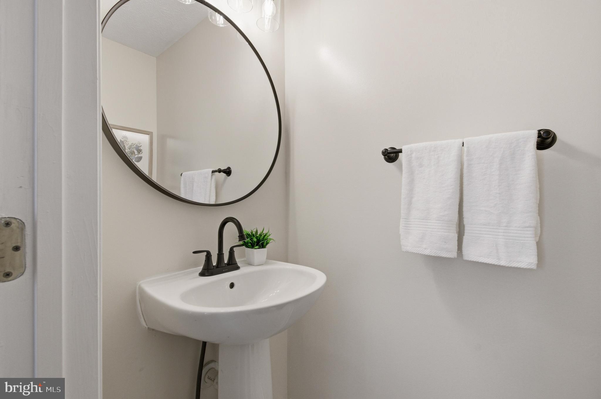 9054 Constant Course Columbia, MD 21046 - Photo 15 of 61 a bathroom with a sink and mirror