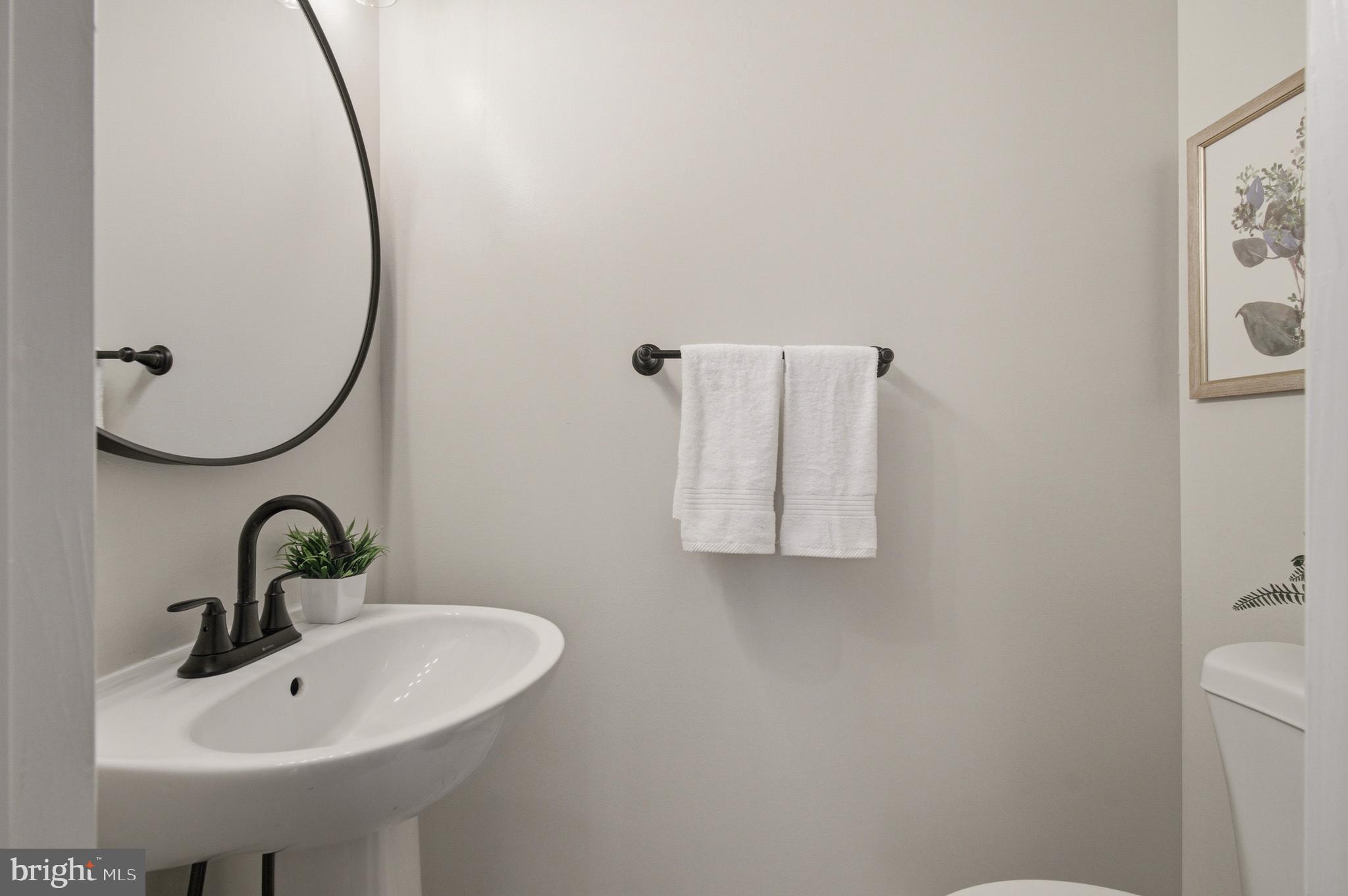 9054 Constant Course Columbia, MD 21046 - Photo 16 of 61 a bathroom with a sink and mirror