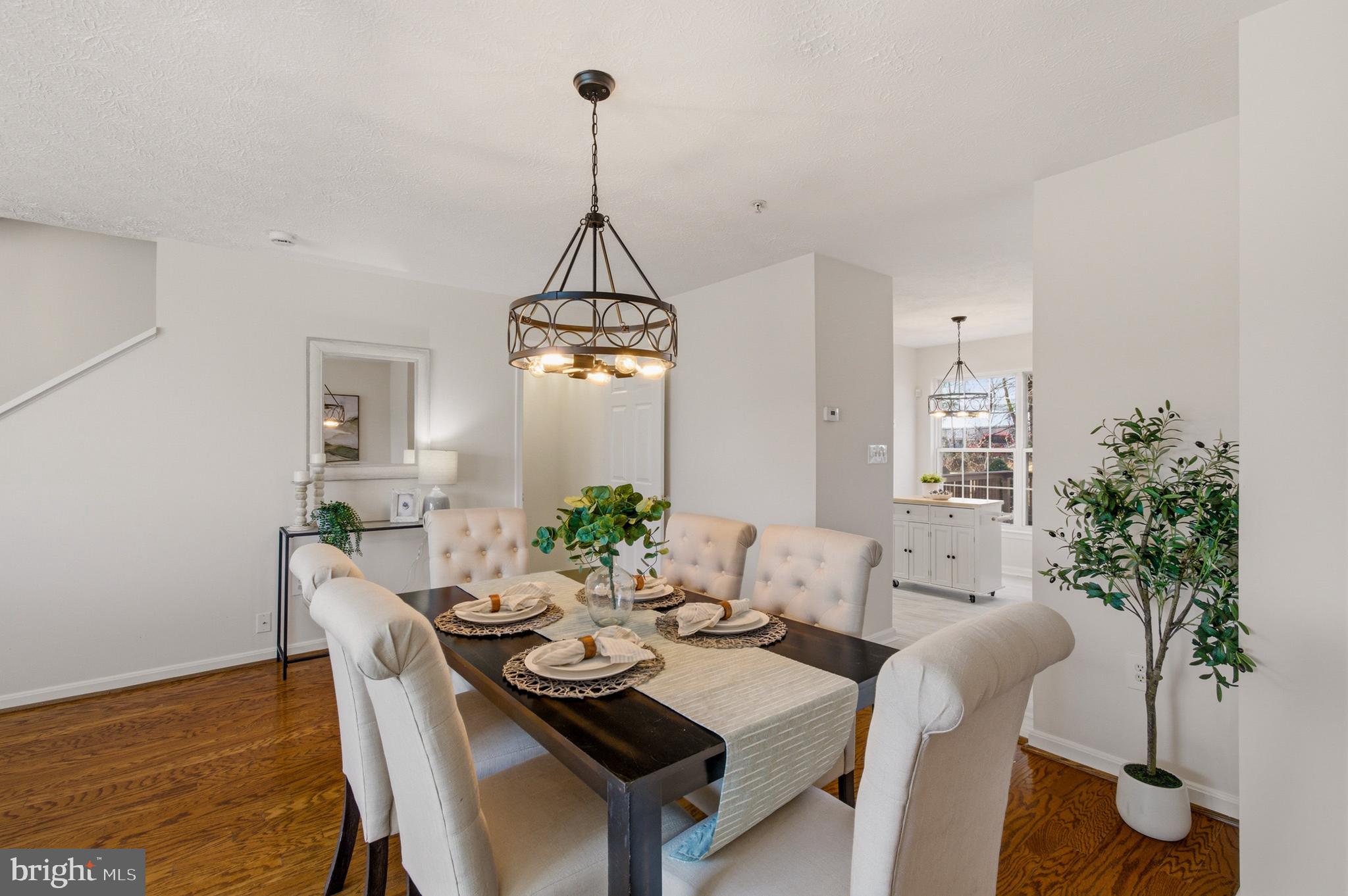 9054 Constant Course Columbia, MD 21046 - Photo 20 of 61 a view of a dining room with furniture window and wooden floor