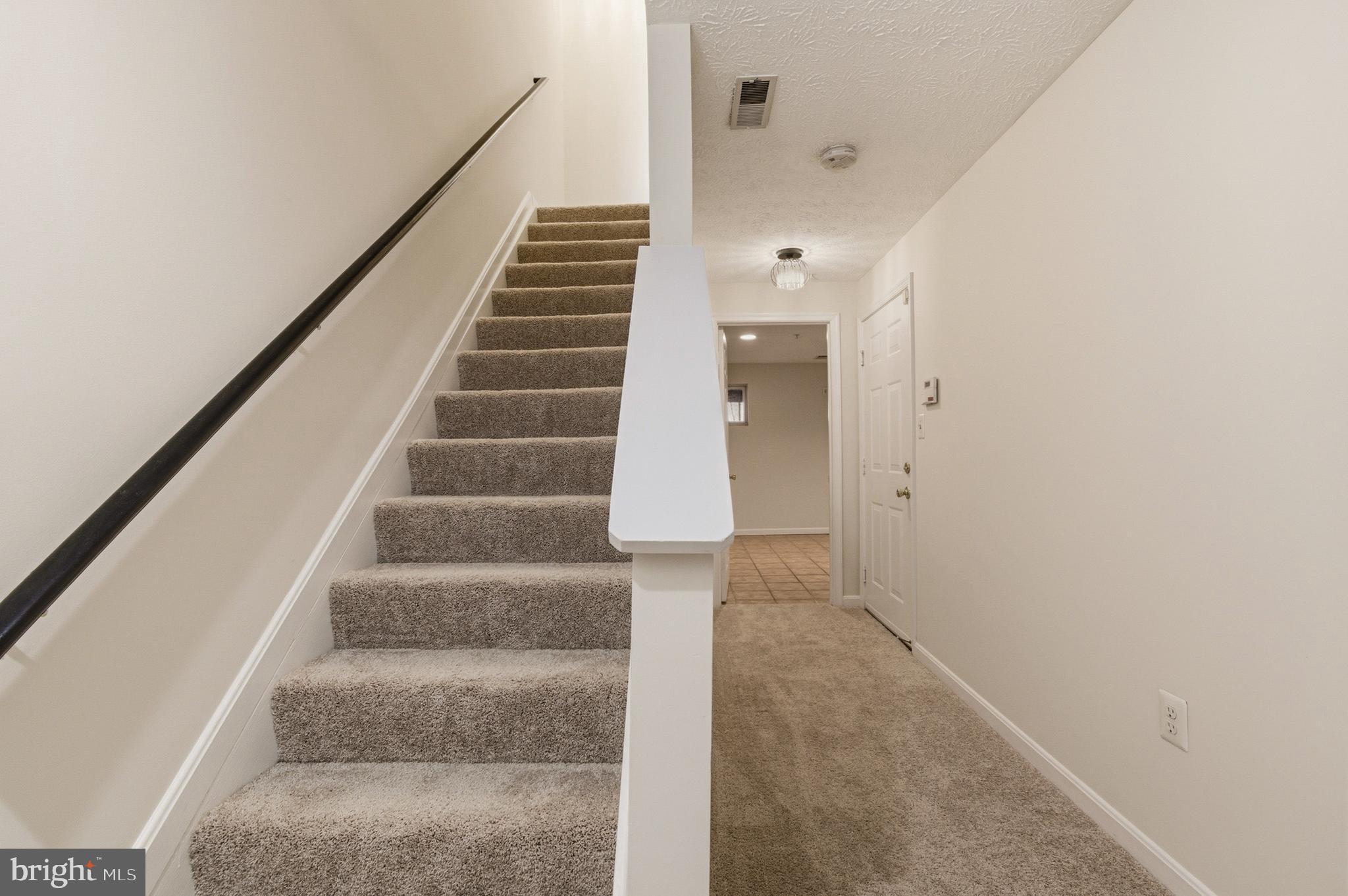 9054 Constant Course Columbia, MD 21046 - Photo 35 of 61 a view of an entryway with staircase