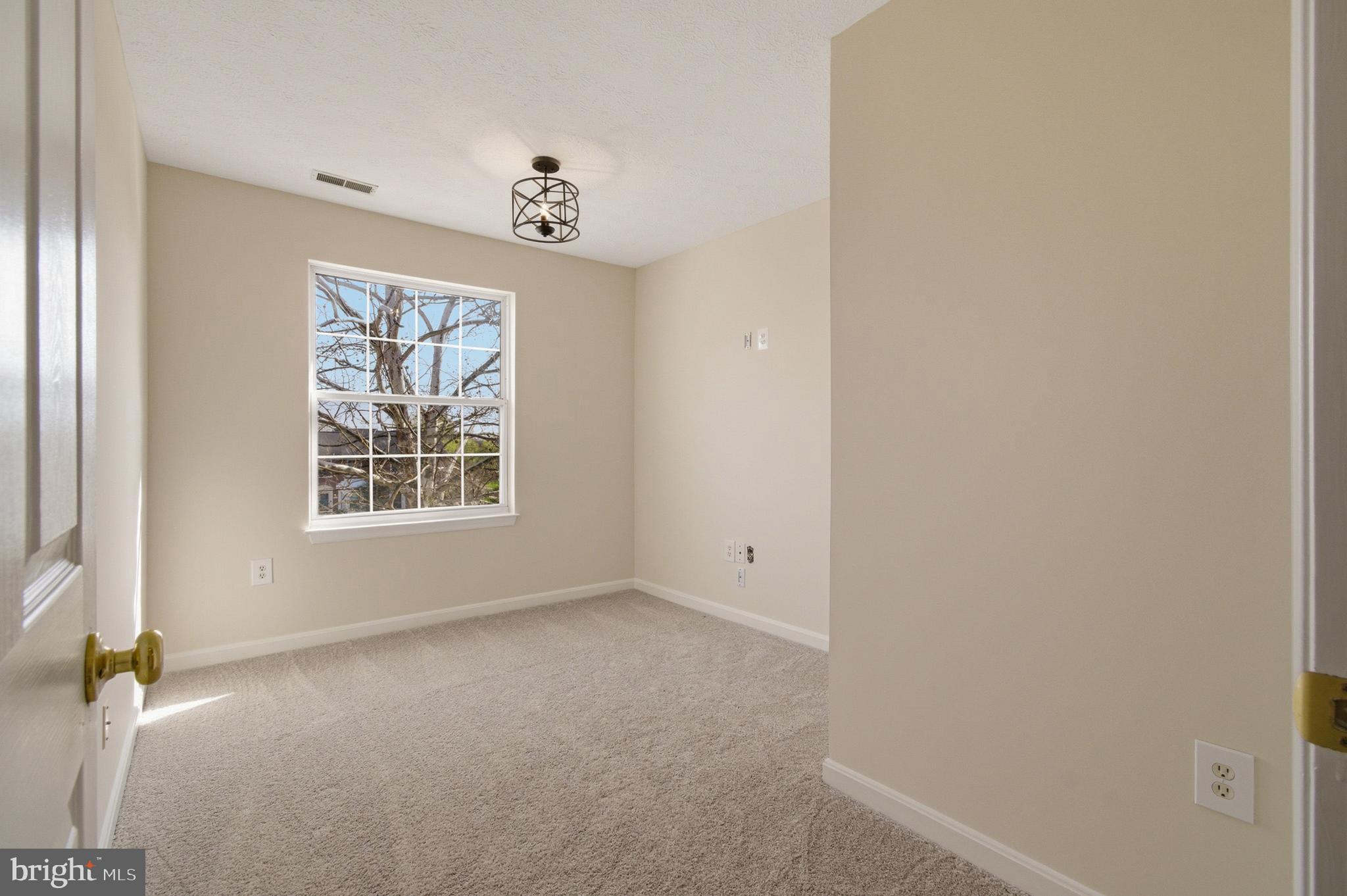 9054 Constant Course Columbia, MD 21046 - Photo 45 of 61 an empty room with a window