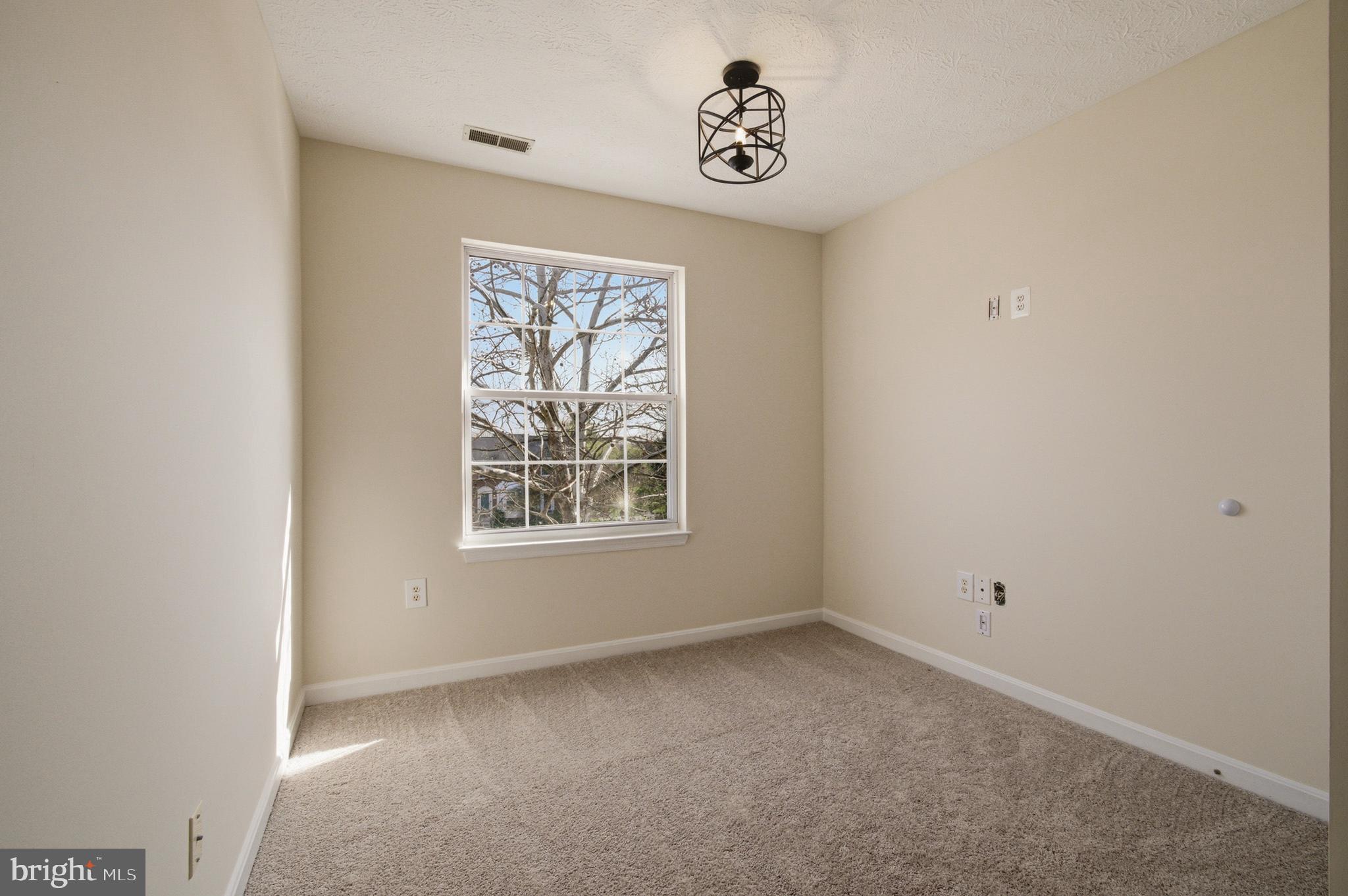 9054 Constant Course Columbia, MD 21046 - Photo 47 of 61 an empty room with a window