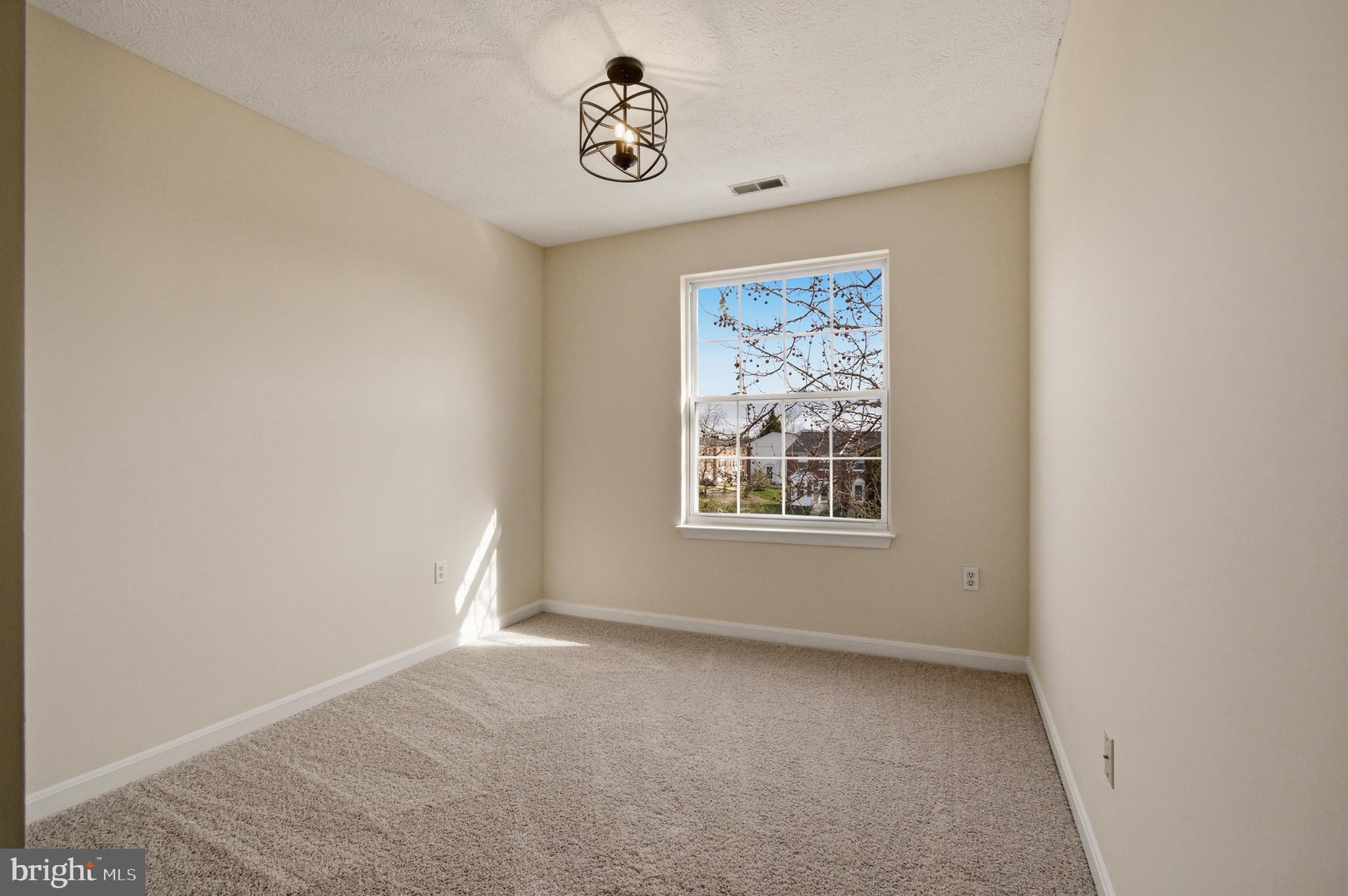 9054 Constant Course Columbia, MD 21046 - Photo 48 of 61 an empty room with a window