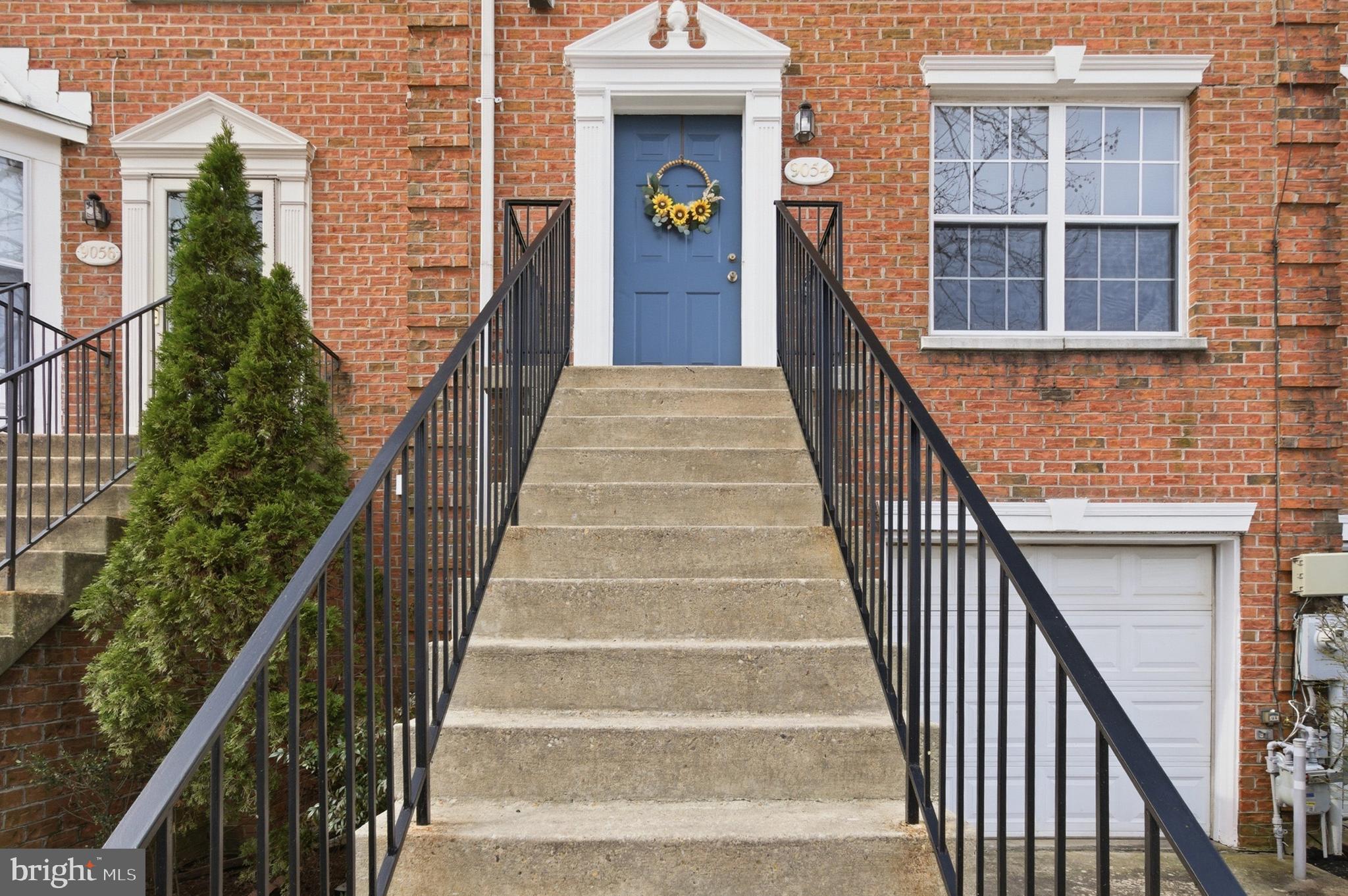 9054 Constant Course Columbia, MD 21046 - Photo 5 of 61 a view of staircase with wooden floor and a front door