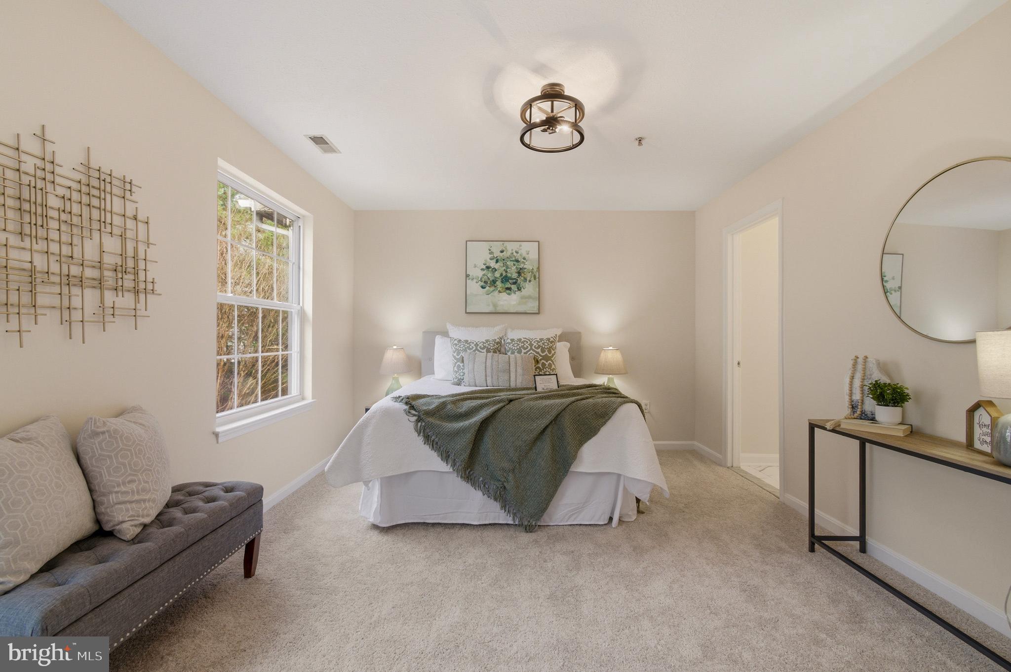 9054 Constant Course Columbia, MD 21046 - Photo 52 of 61 a living room with a bed furniture and a window