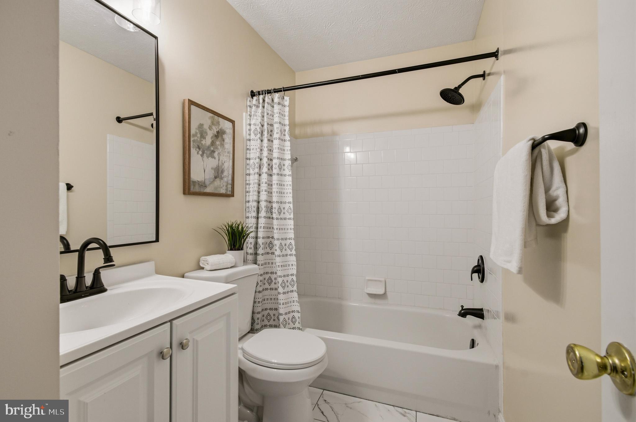 9054 Constant Course Columbia, MD 21046 - Photo 55 of 61 a bathroom with a sink toilet and shower