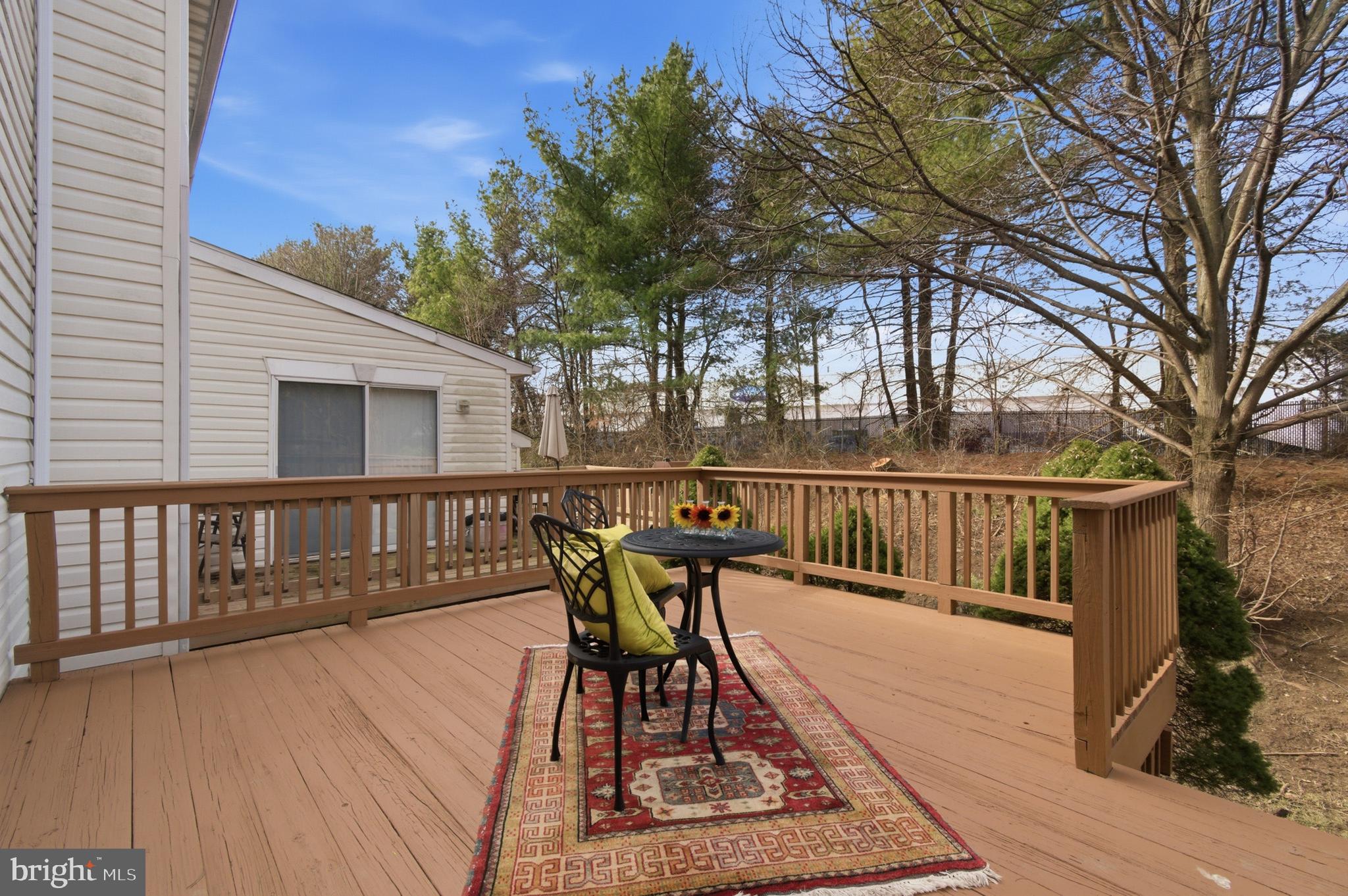 9054 Constant Course Columbia, MD 21046 - Photo 56 of 61 a view of balcony with wooden floor and outdoor seating