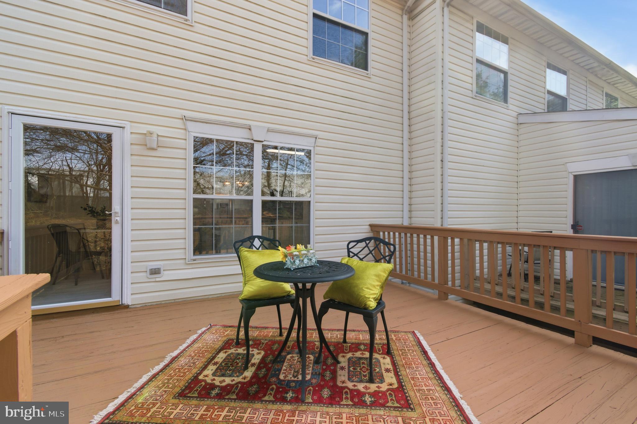 9054 Constant Course Columbia, MD 21046 - Photo 59 of 61 a view of a wooden chairs on the deck