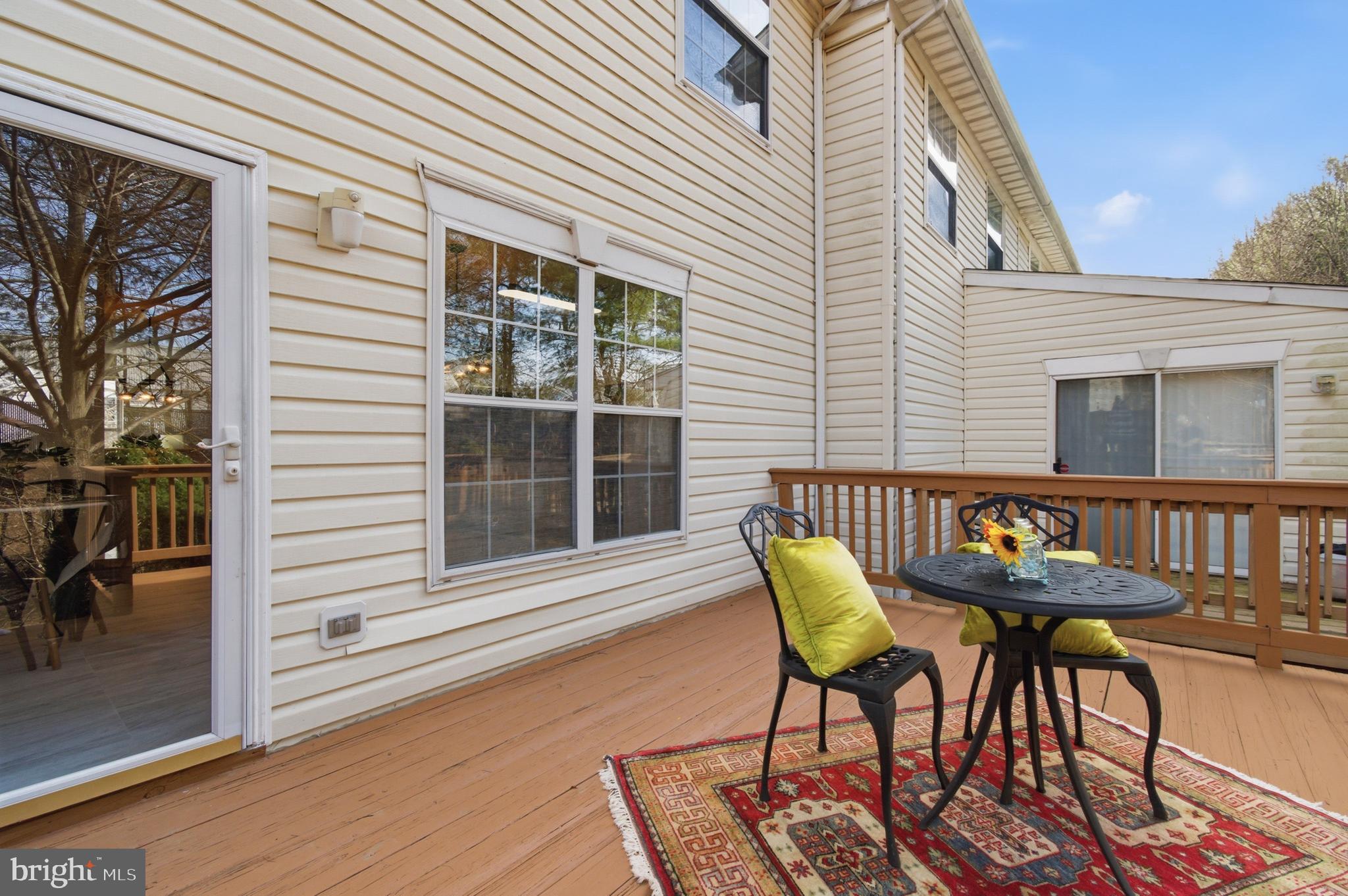 9054 Constant Course Columbia, MD 21046 - Photo 61 of 61 a balcony with table and chairs and potted plants