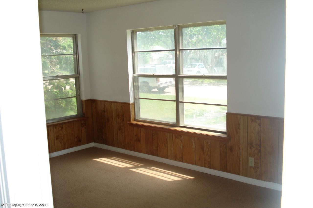 4202 Cline Road Amarillo, TX 79110 - Photo 2 of 7 a view of an empty room with a window