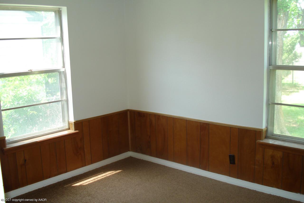 4202 Cline Road Amarillo, TX 79110 - Photo 7 of 7 an empty room with a window