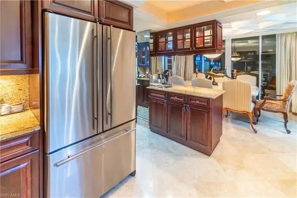 a kitchen with sink stove and cabinets