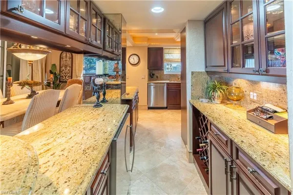 a bedroom with two beds and a chandelier