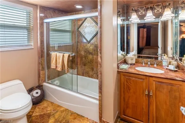 a bed room with a bed and a television