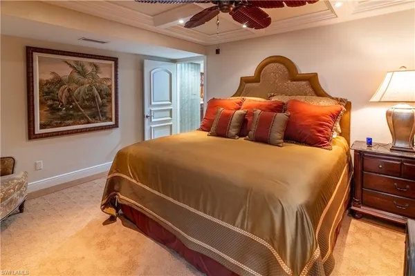 a bathroom with a sink a toilet a mirror and shower