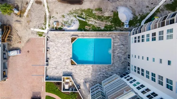 swimming view of a swimming pool with a yard