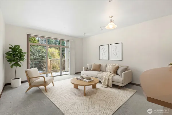 a living room with furniture and a large window