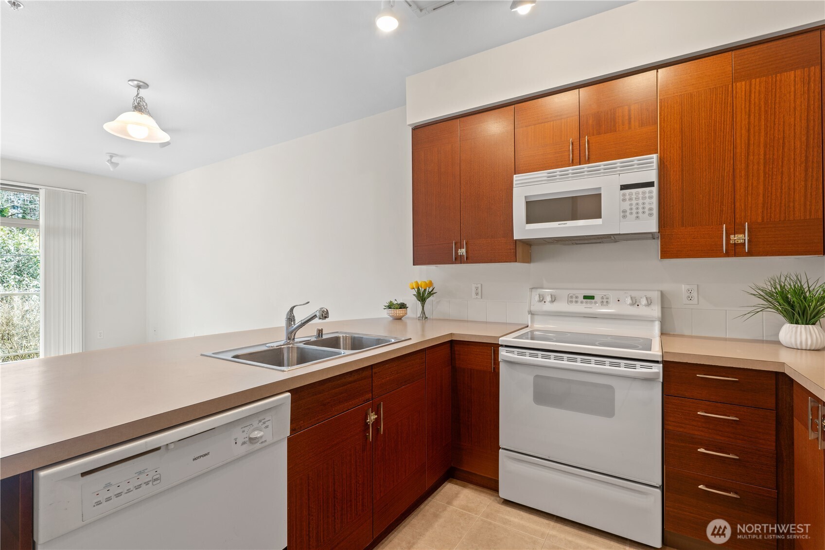 910 Gladstone Street, Unit 103 Bellingham, WA 98229 - Photo 11 of 28 a kitchen with a sink and cabinets