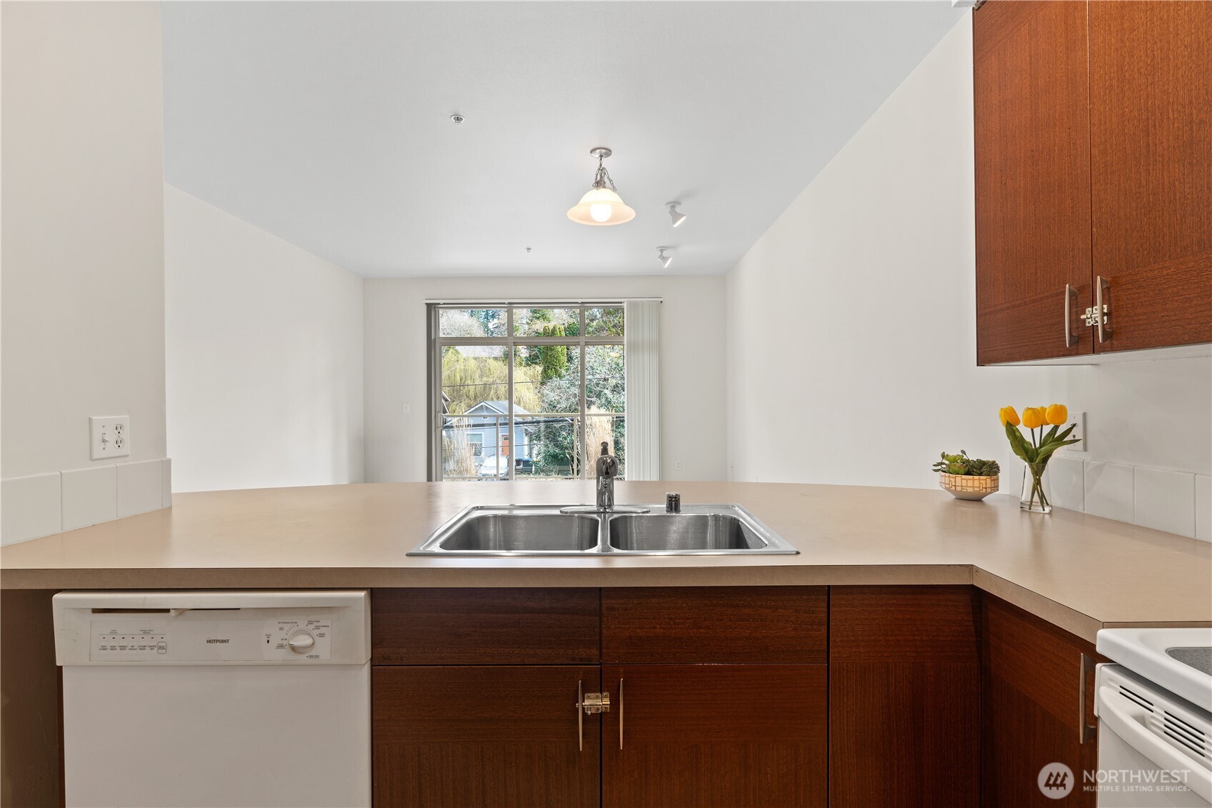 910 Gladstone Street, Unit 103 Bellingham, WA 98229 - Photo 12 of 28 a kitchen with a sink and cabinets
