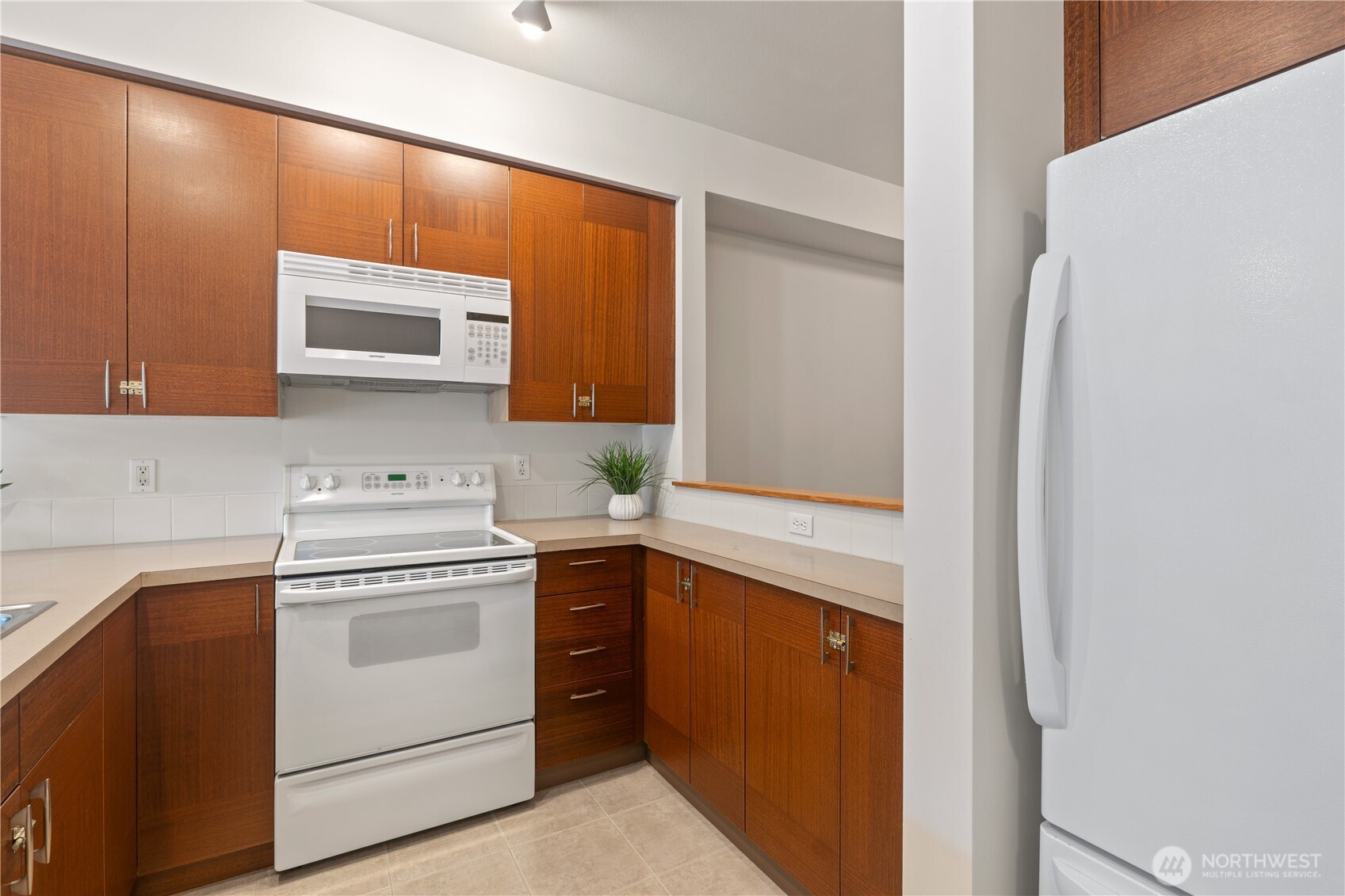 910 Gladstone Street, Unit 103 Bellingham, WA 98229 - Photo 13 of 28 a kitchen with a stove microwave and sink