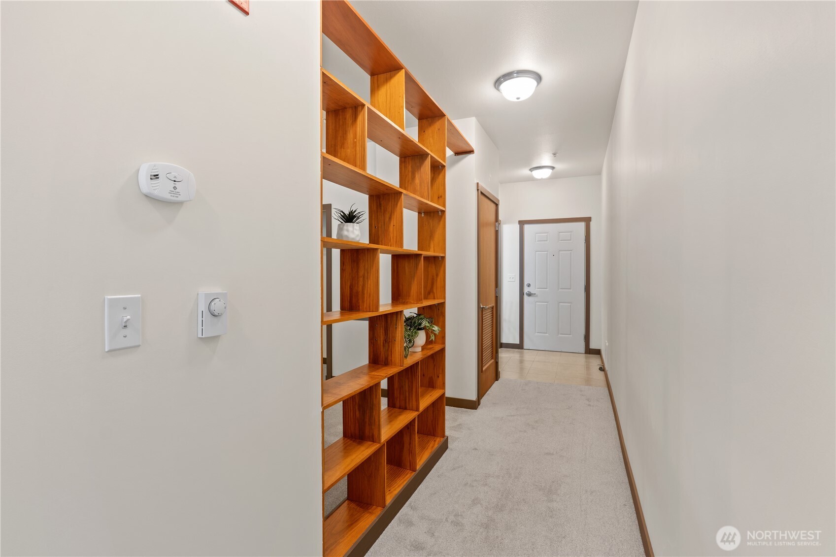 910 Gladstone Street, Unit 103 Bellingham, WA 98229 - Photo 14 of 28 a view of hallway with stairs and wooden floor