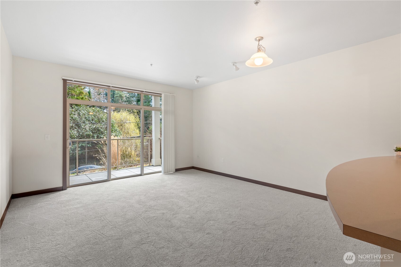 910 Gladstone Street, Unit 103 Bellingham, WA 98229 - Photo 2 of 28 wooden floor in an empty room with a window