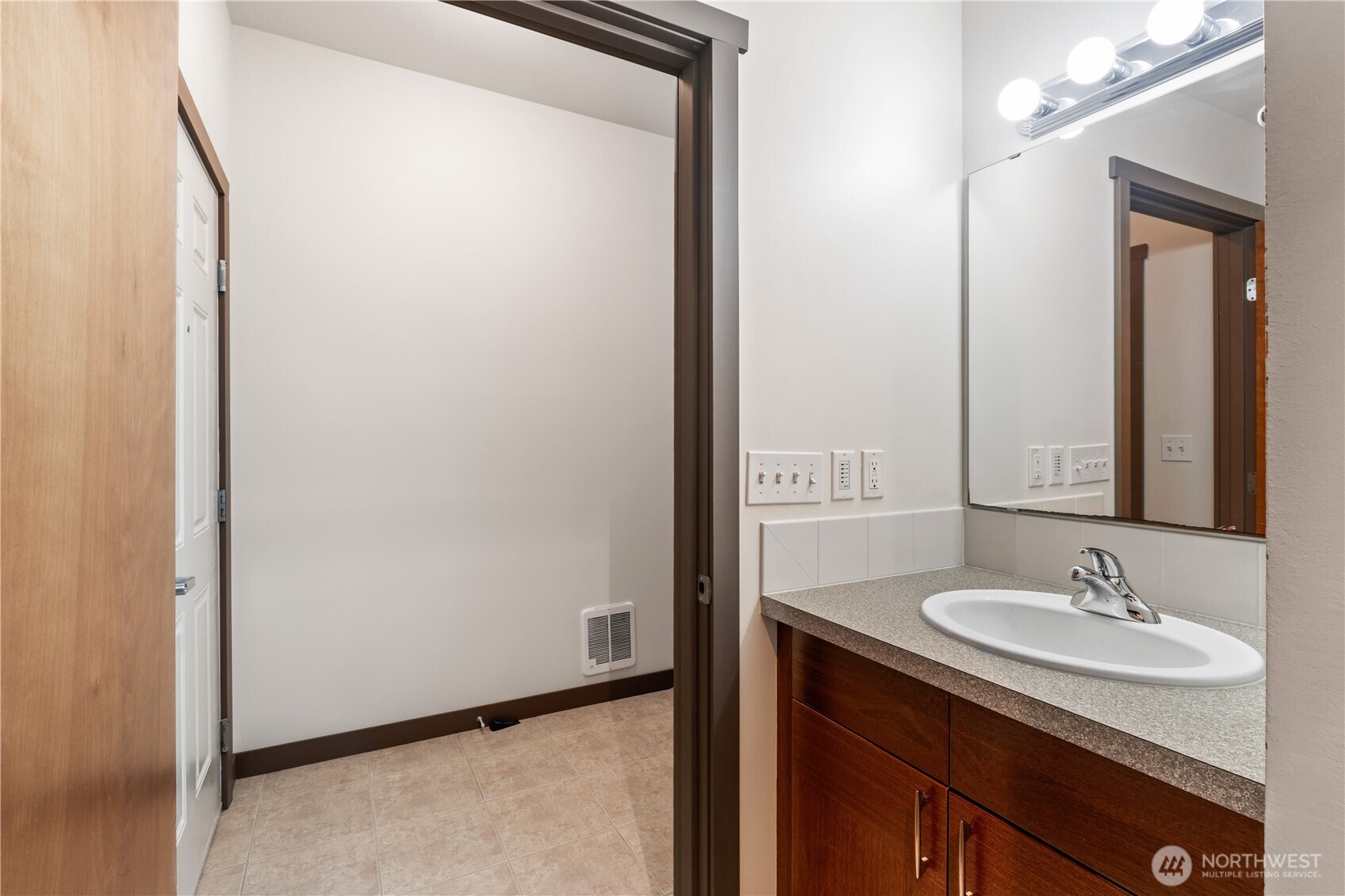 910 Gladstone Street, Unit 103 Bellingham, WA 98229 - Photo 21 of 28 a bathroom with a sink and a mirror
