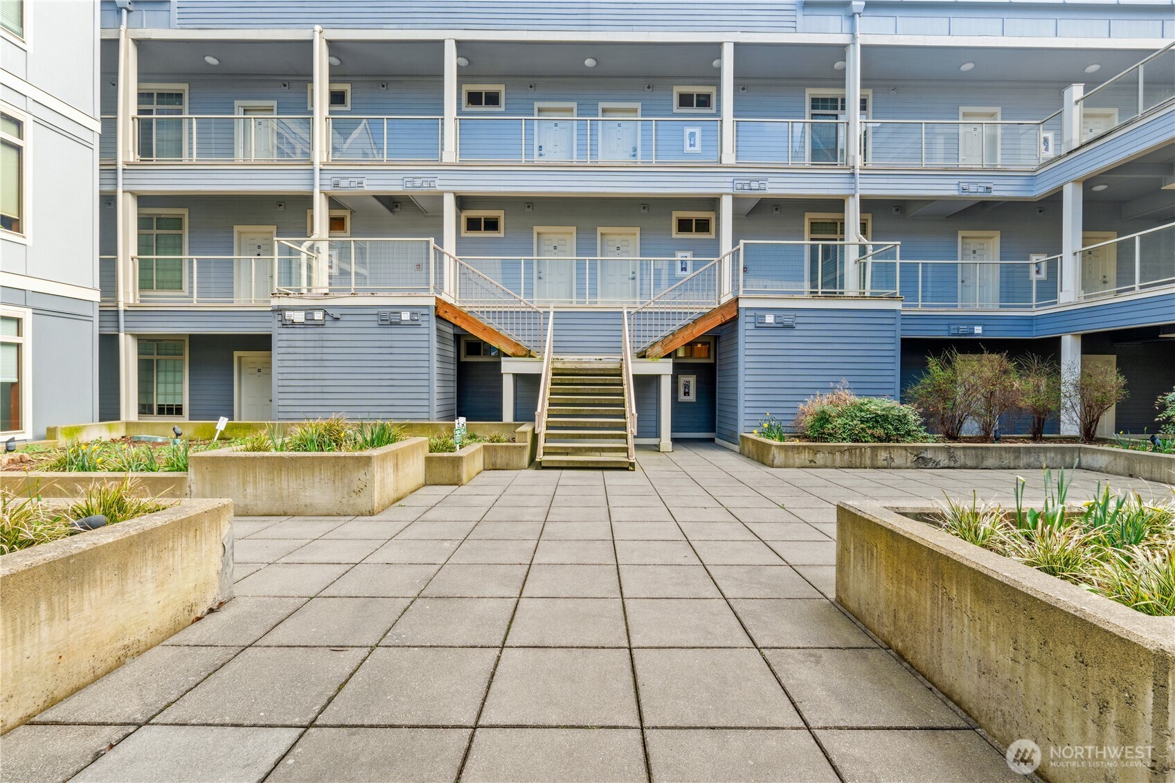 910 Gladstone Street, Unit 103 Bellingham, WA 98229 - Photo 24 of 28 a front view of a building with a outdoor seating