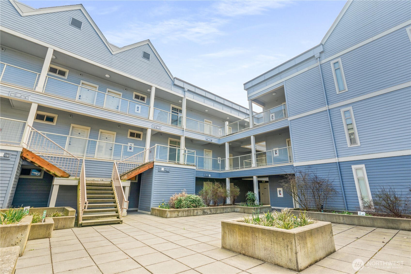 910 Gladstone Street, Unit 103 Bellingham, WA 98229 - Photo 25 of 28 a front view of a building with glass windows
