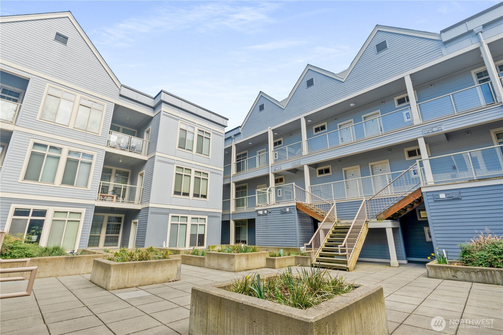 910 Gladstone Street, Unit 103 Bellingham, WA 98229 - Photo 26 of 28 a front view of a building with glass windows