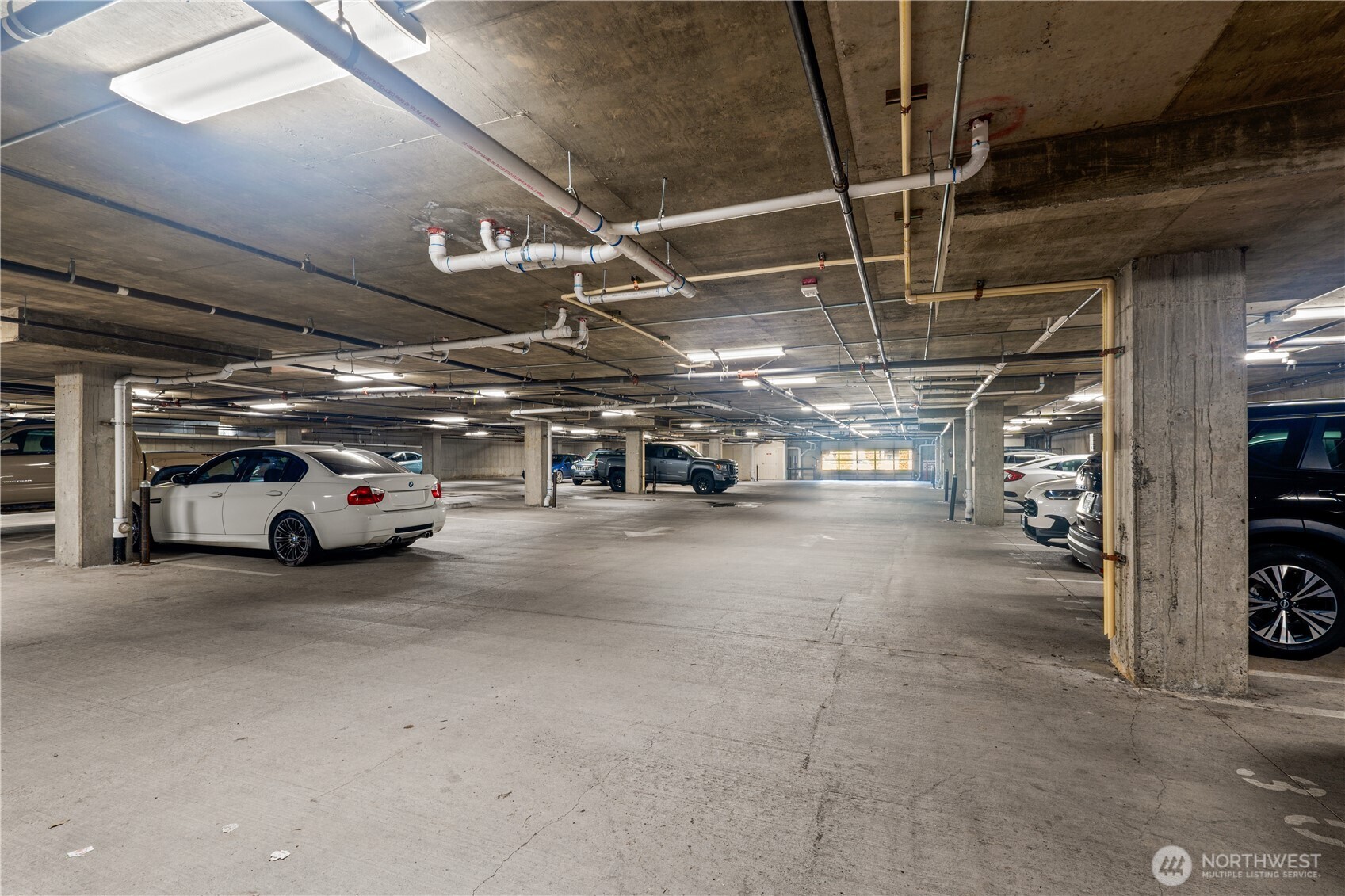910 Gladstone Street, Unit 103 Bellingham, WA 98229 - Photo 27 of 28 a view of parking garage with cars