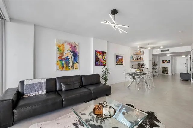 a bathroom with a bathtub shower sink mirror and