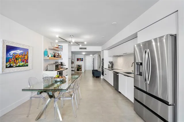 a living room with furniture large window and flat screen tv